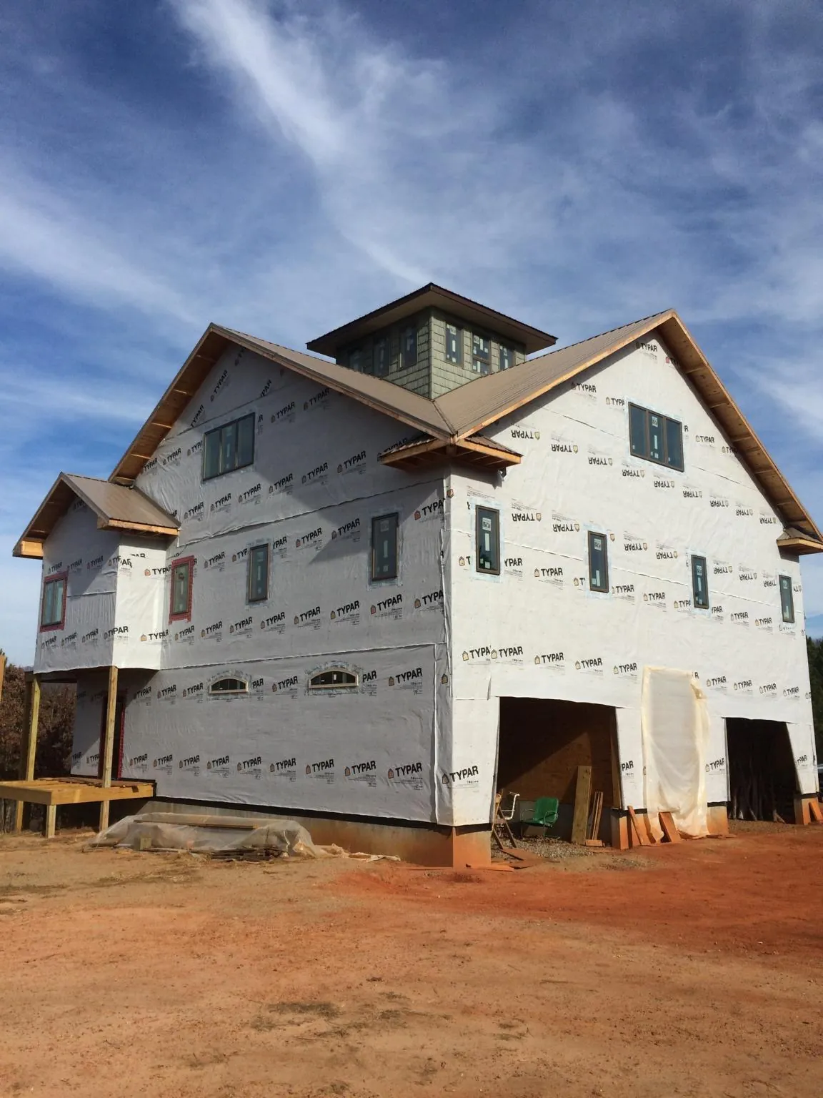 New two story house under construction with a cupola and gabled roofs in Leonardtown